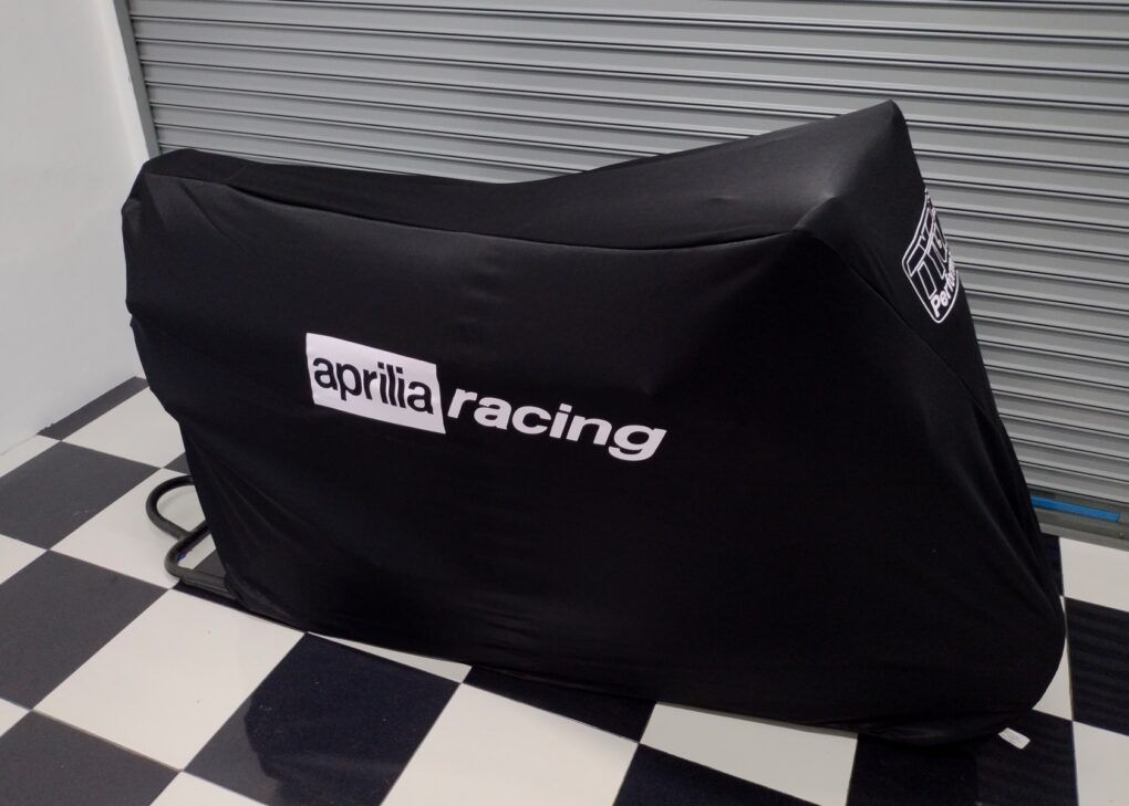 Telo coprimoto antipolvere TYGA, Nero (RACE), Aprilia Racing